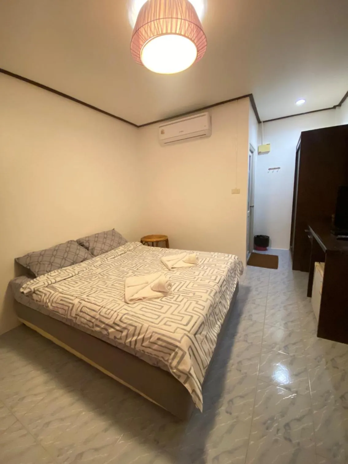 Bed in Baan Rom Mai Resort