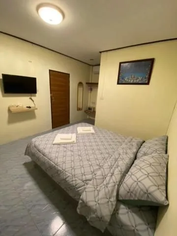 Bed in Baan Rom Mai Resort