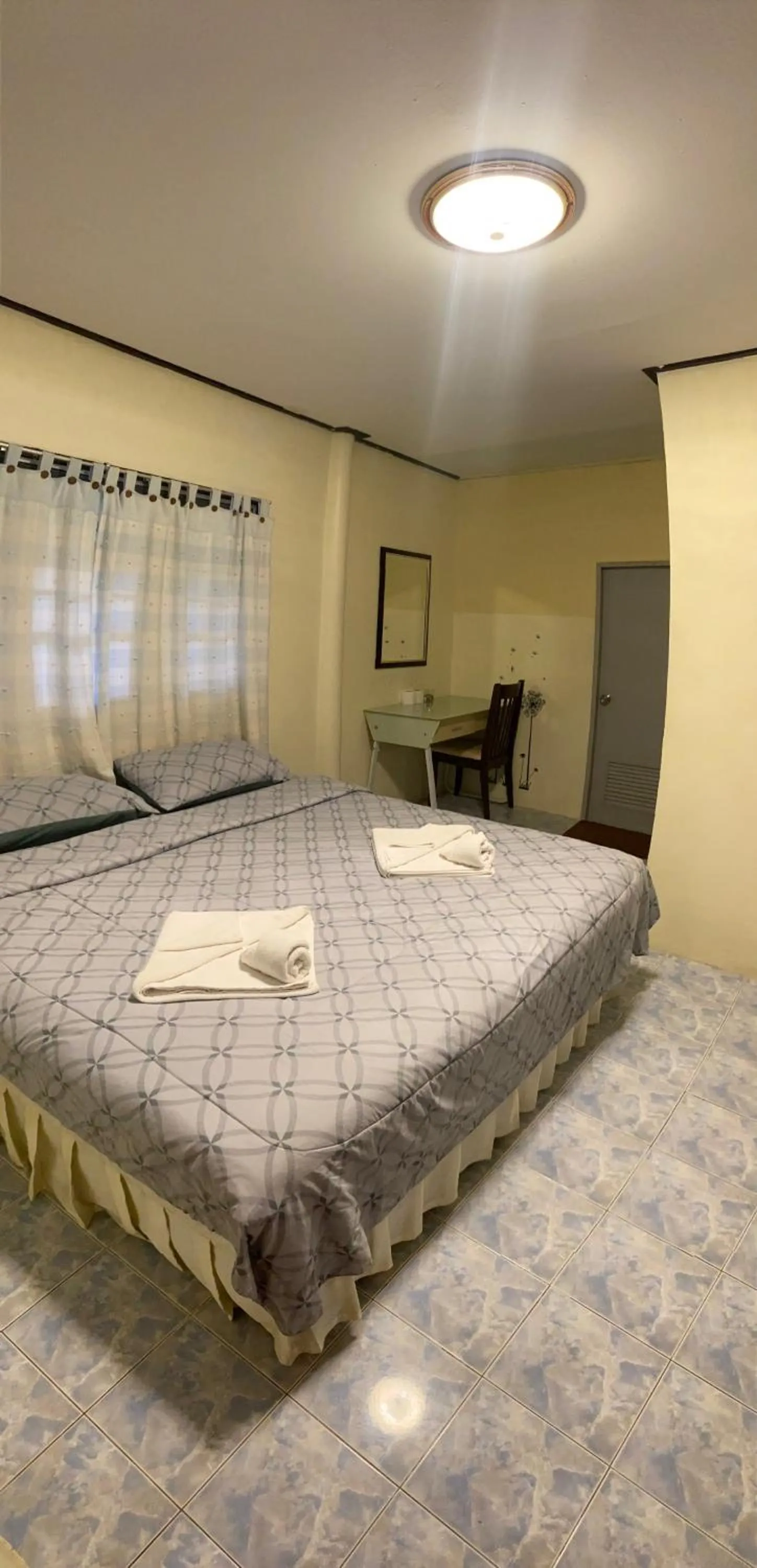 Bed in Baan Rom Mai Resort