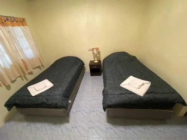 Bed in Baan Rom Mai Resort