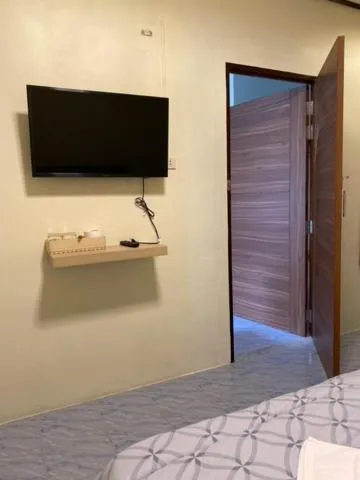 Bed in Baan Rom Mai Resort