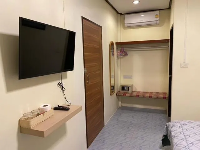 Bed in Baan Rom Mai Resort