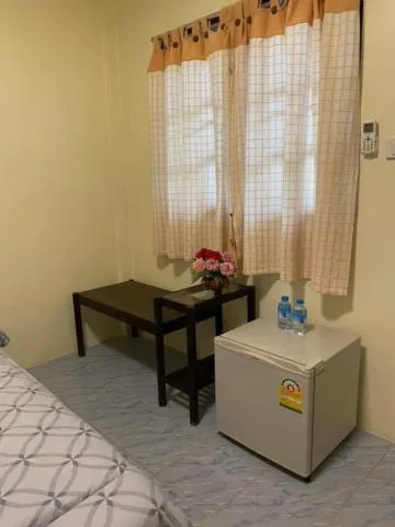 Bed in Baan Rom Mai Resort