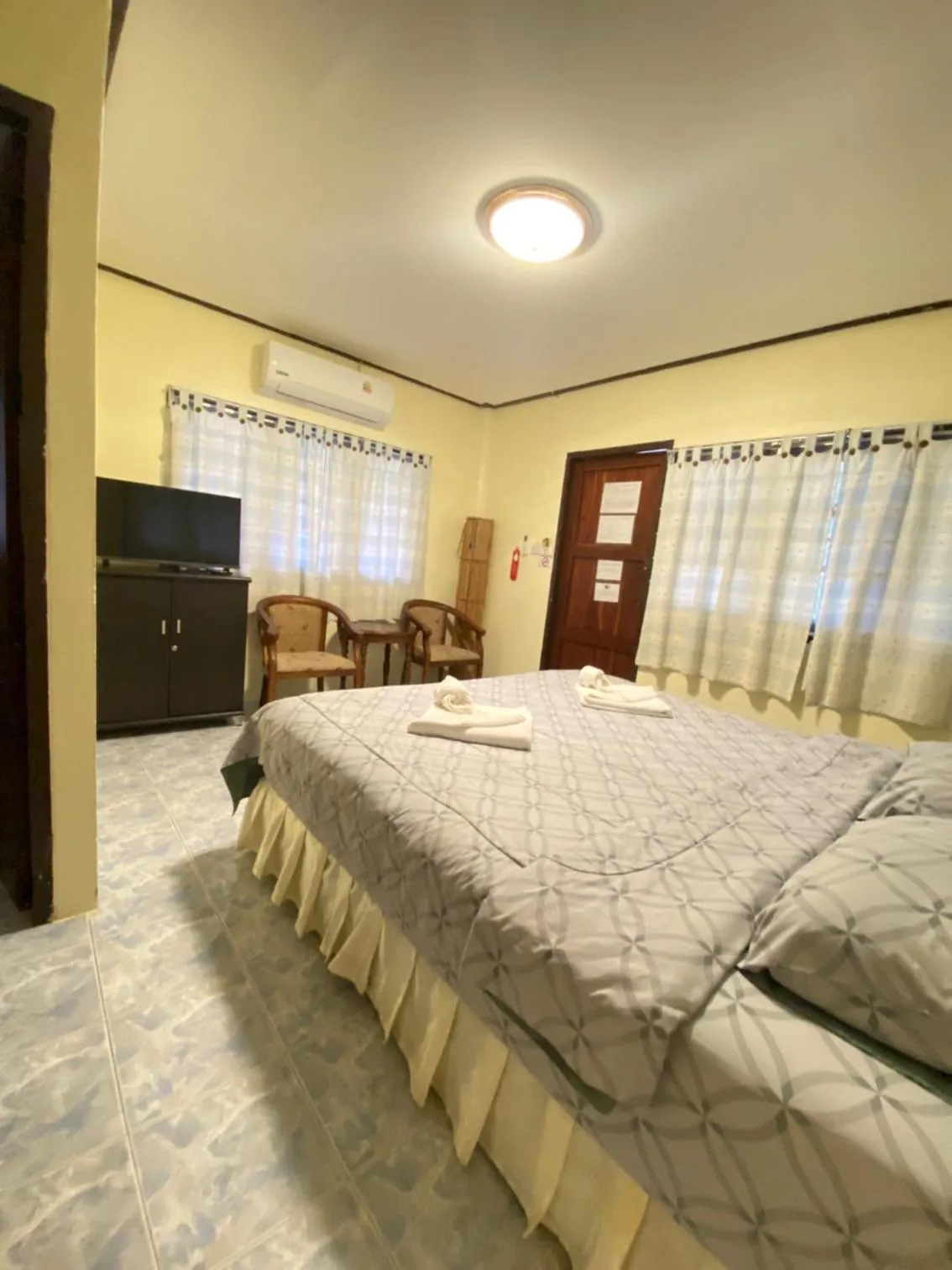 Bed in Baan Rom Mai Resort