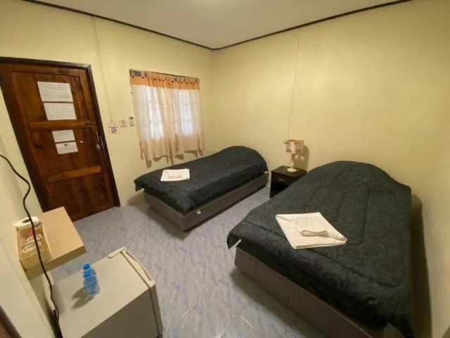 Bed in Baan Rom Mai Resort