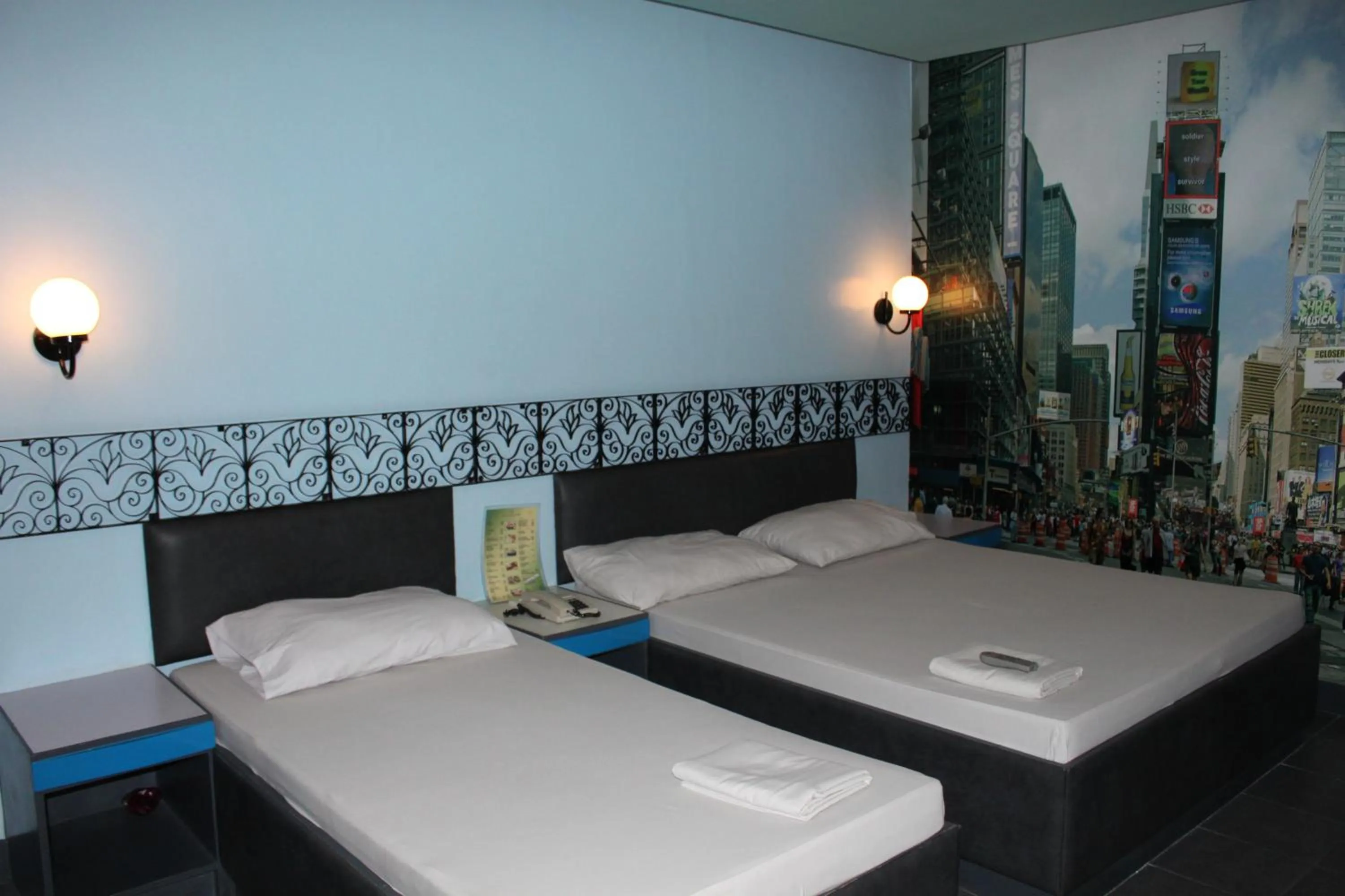 Bed in Urban Travellers Hotel