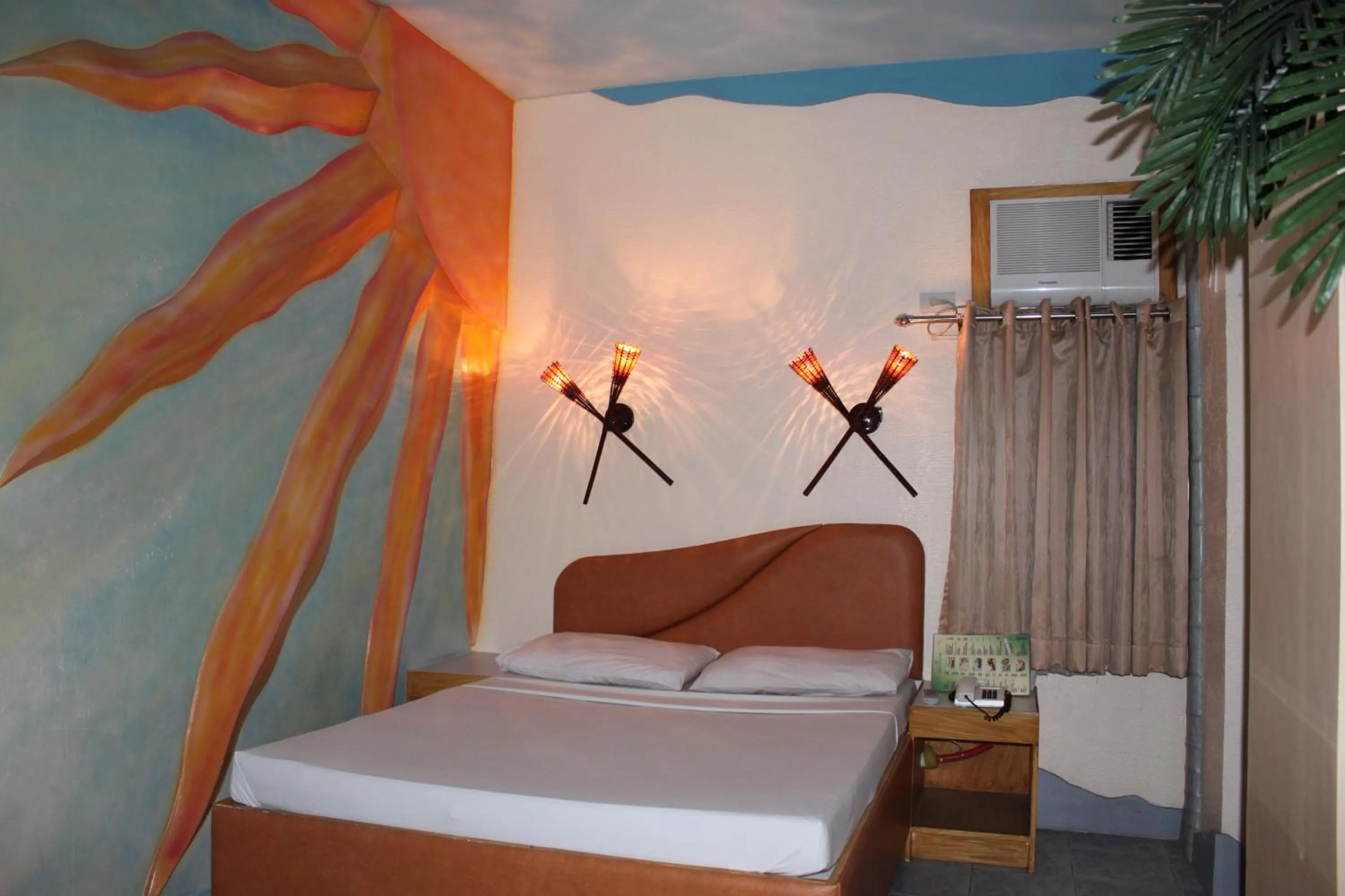 Bed in Urban Travellers Hotel