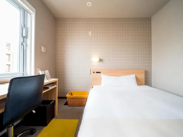 Bed in Super Hotel Takamatsu Kin en kan