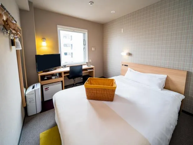 Bed in Super Hotel Takamatsu Kin en kan