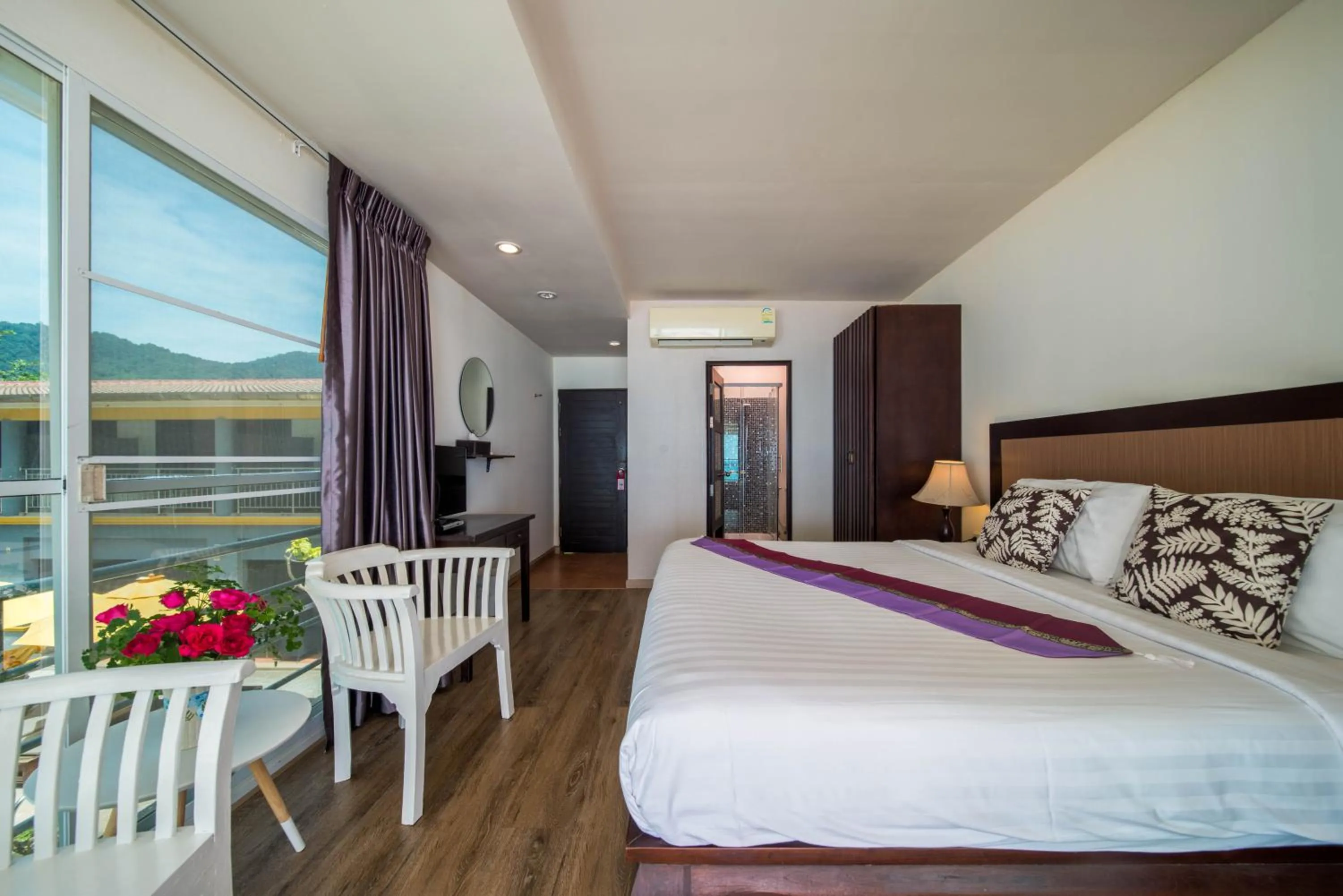 Bed in Kamala Beachfront Apartment