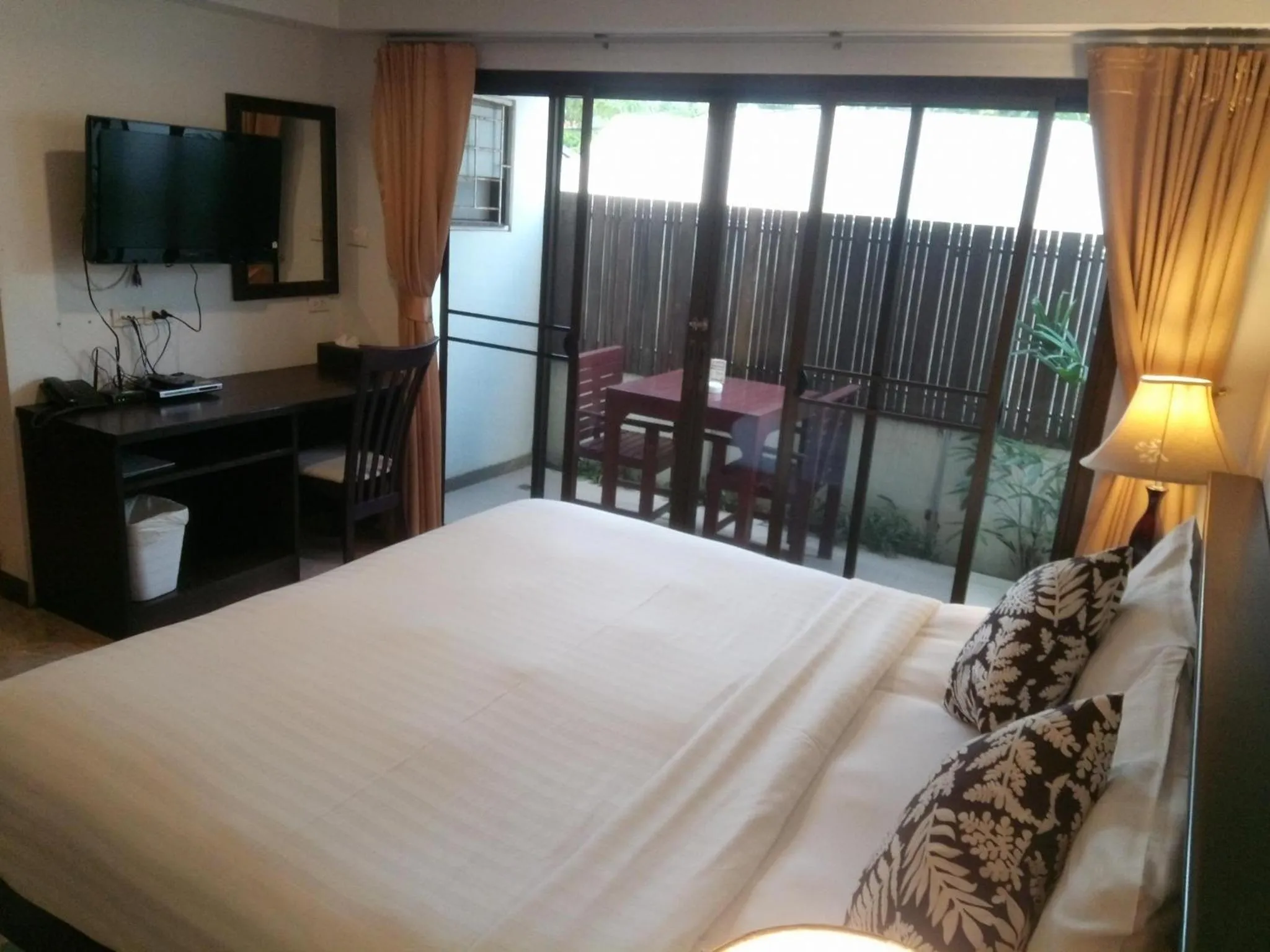Bed in Kamala Beachfront Apartment