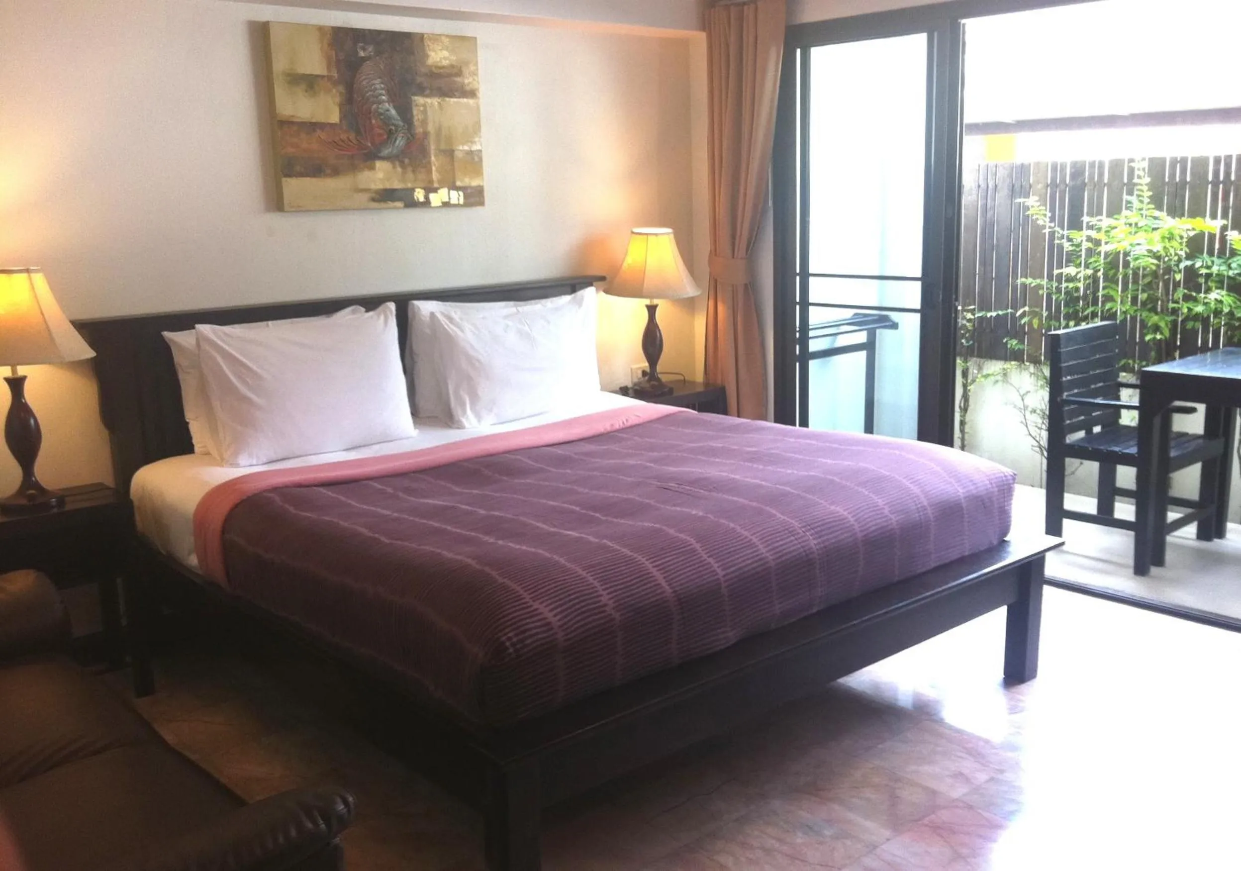 Bed in Kamala Beachfront Apartment