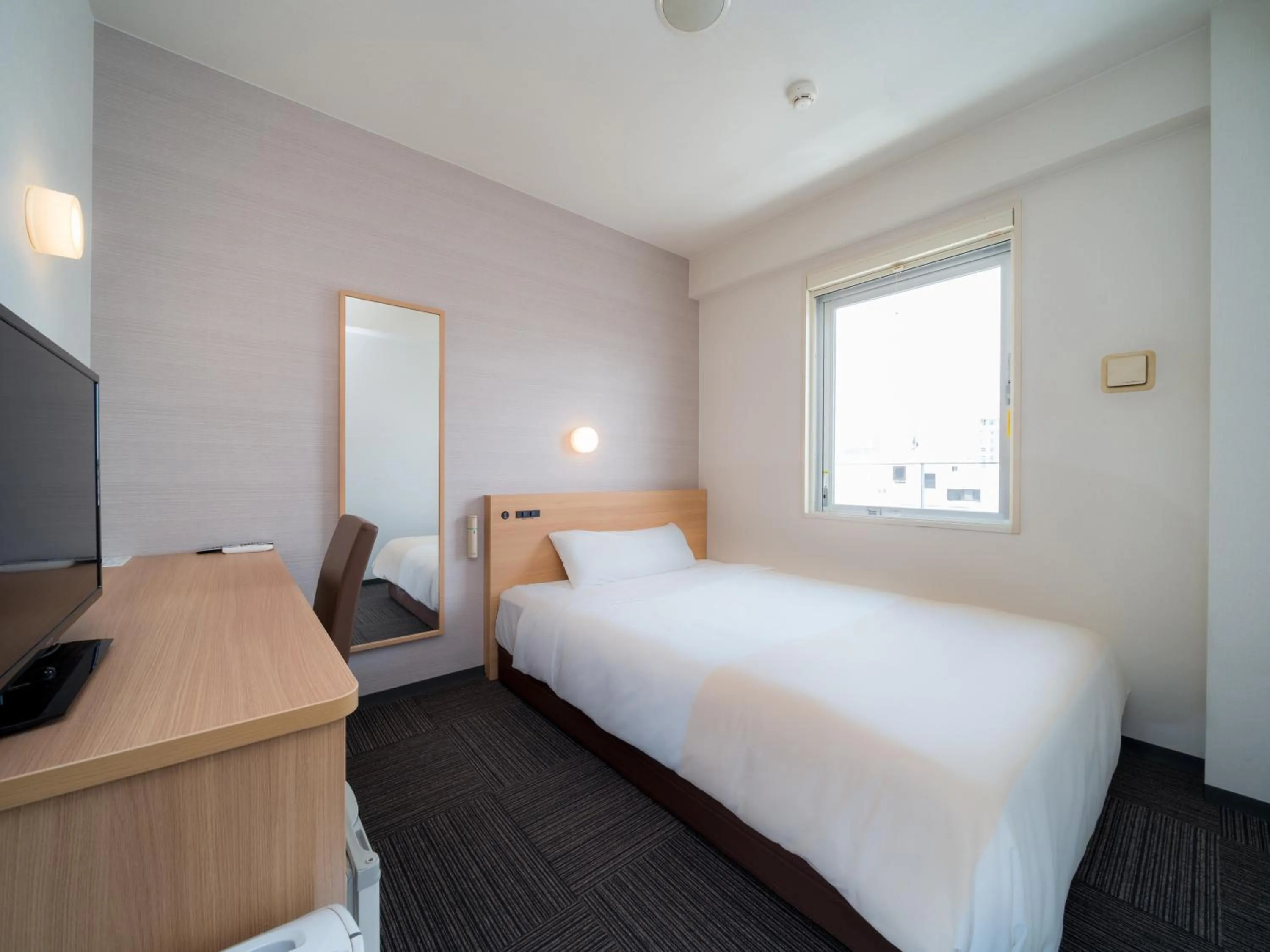 Bed in Super Hotel Takamatsu Tamachi