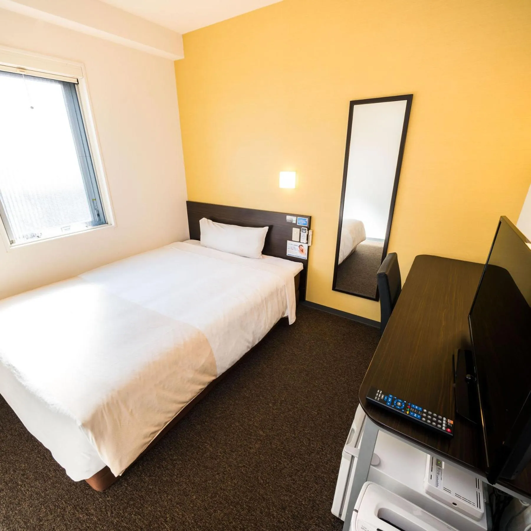 Bed in Super Hotel Niihama