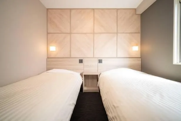 Bed in Super Hotel Niihama