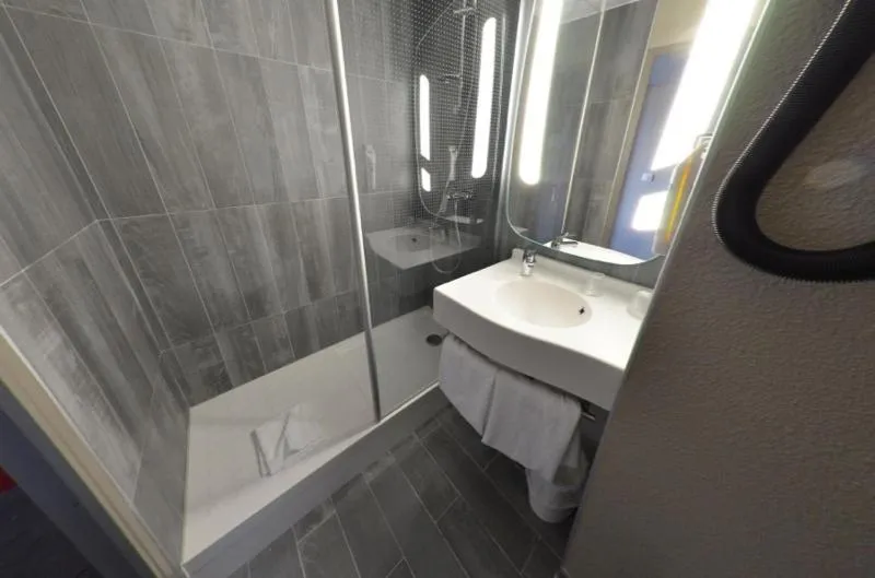 Shower in Hotel Mermoz Paris Le Bourget