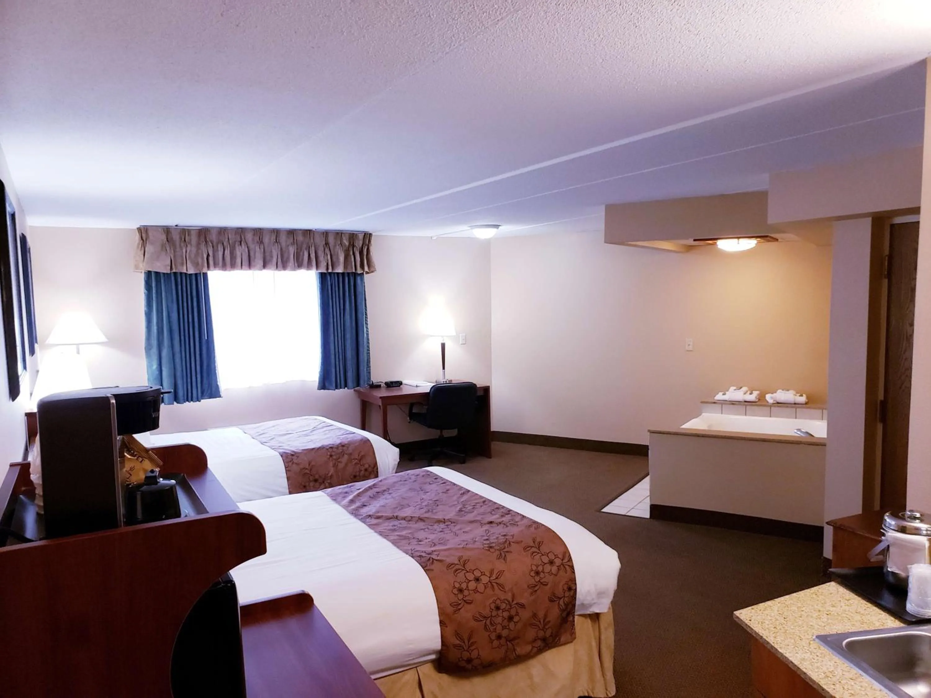 Queen Room with Two Queen Beds and Spa Bath - Non-Smoking in SureStay Plus Hotel by Best Western Black River Falls