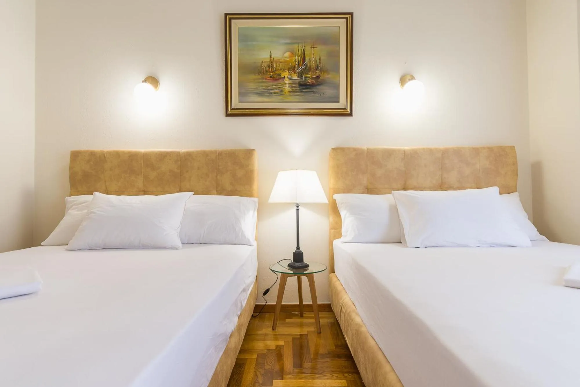 Bed in Victoria Queens Paradise Apartments