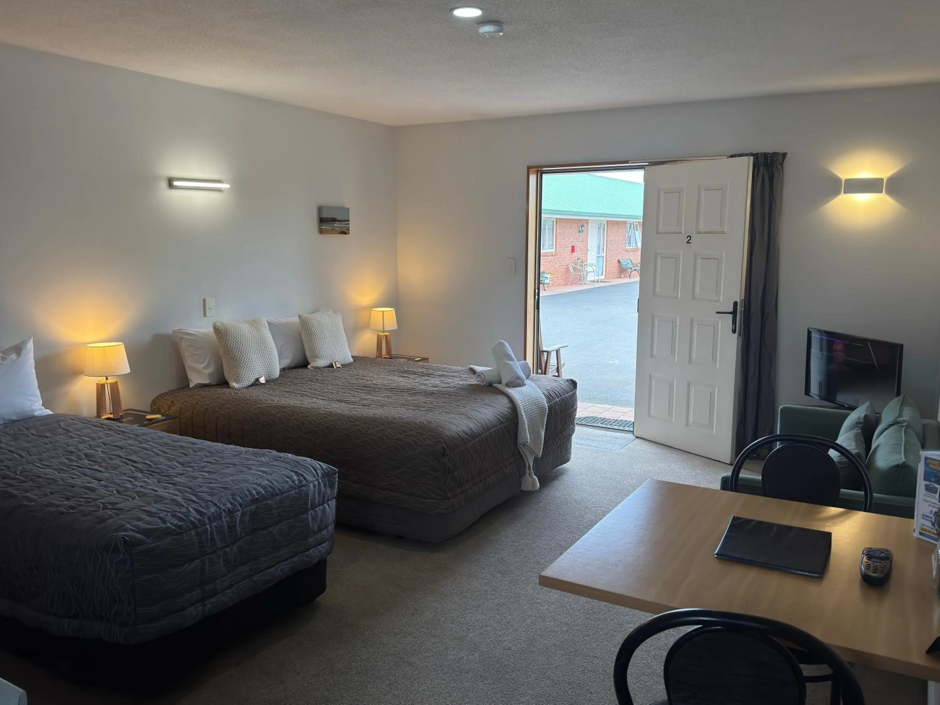 Bed in ASURE Ambassador Motor Lodge