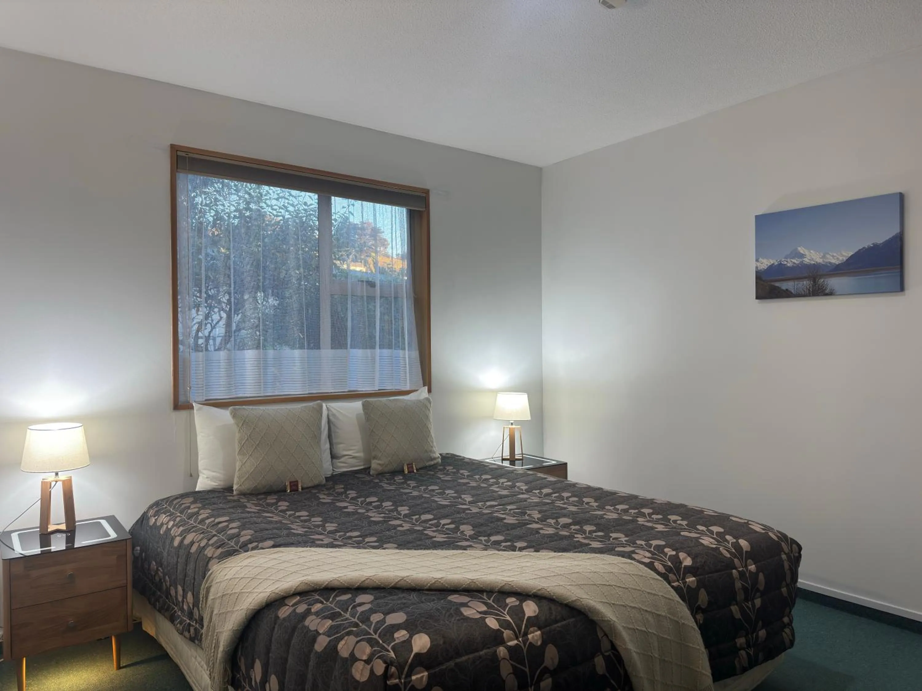 Bed in ASURE Ambassador Motor Lodge