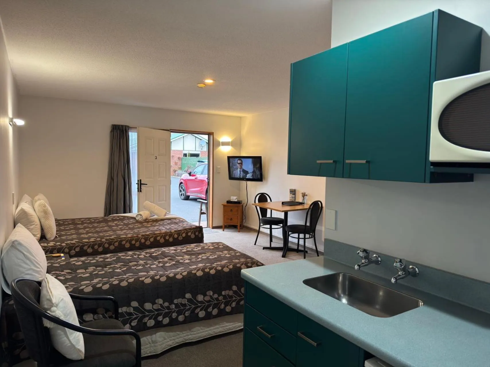 Bedroom in ASURE Ambassador Motor Lodge