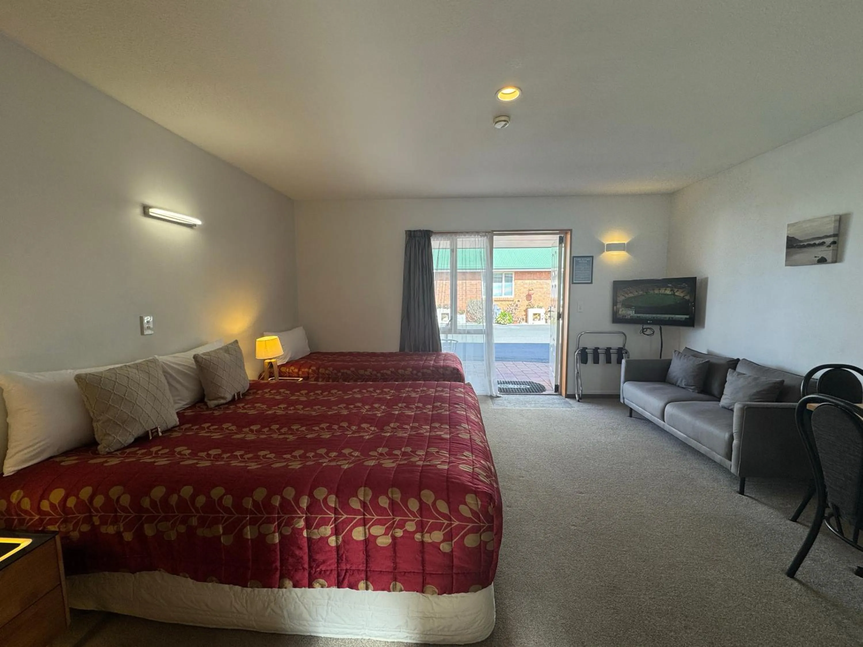 Bed in ASURE Ambassador Motor Lodge