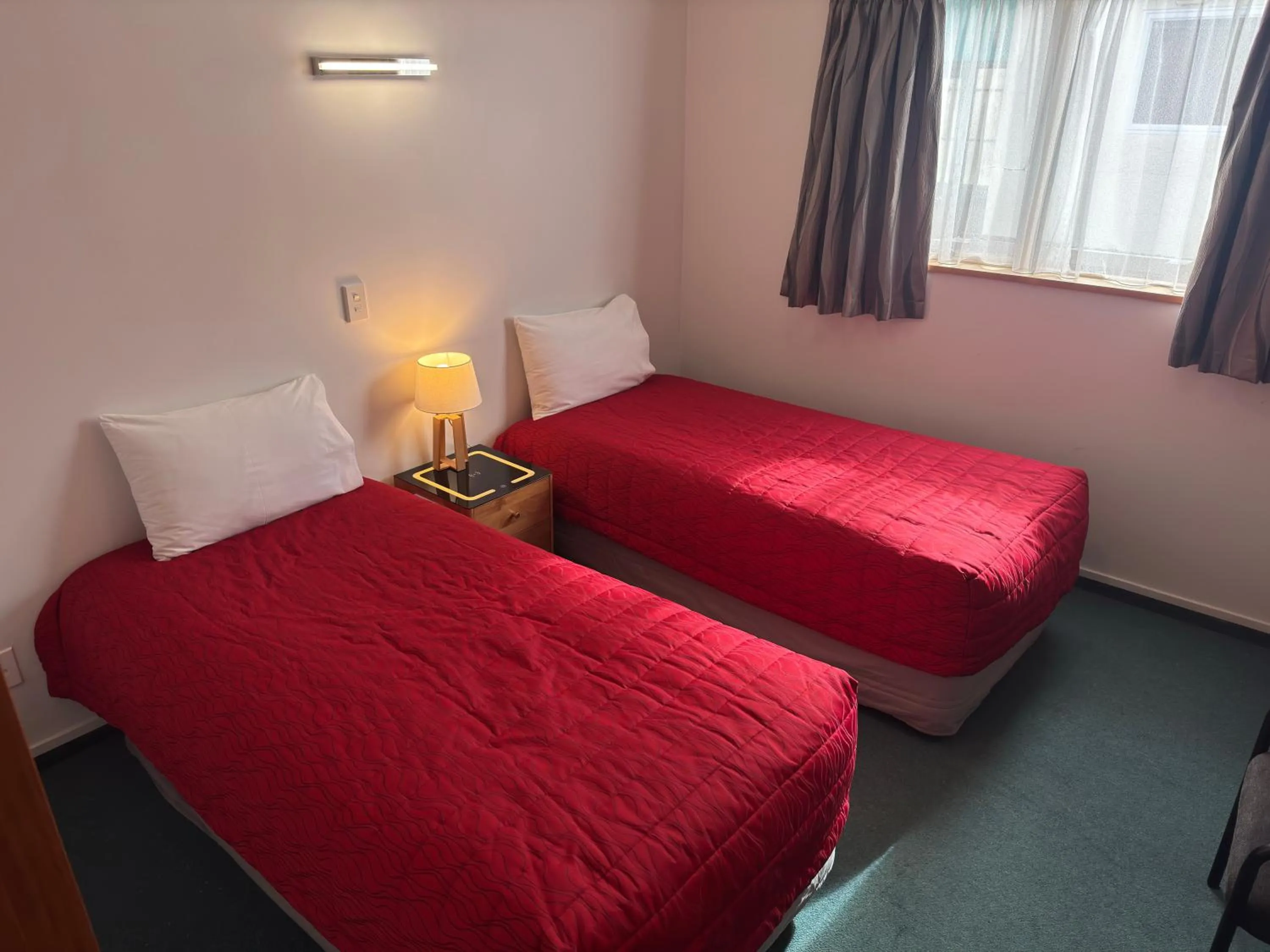 Bedroom, Bed in ASURE Ambassador Motor Lodge