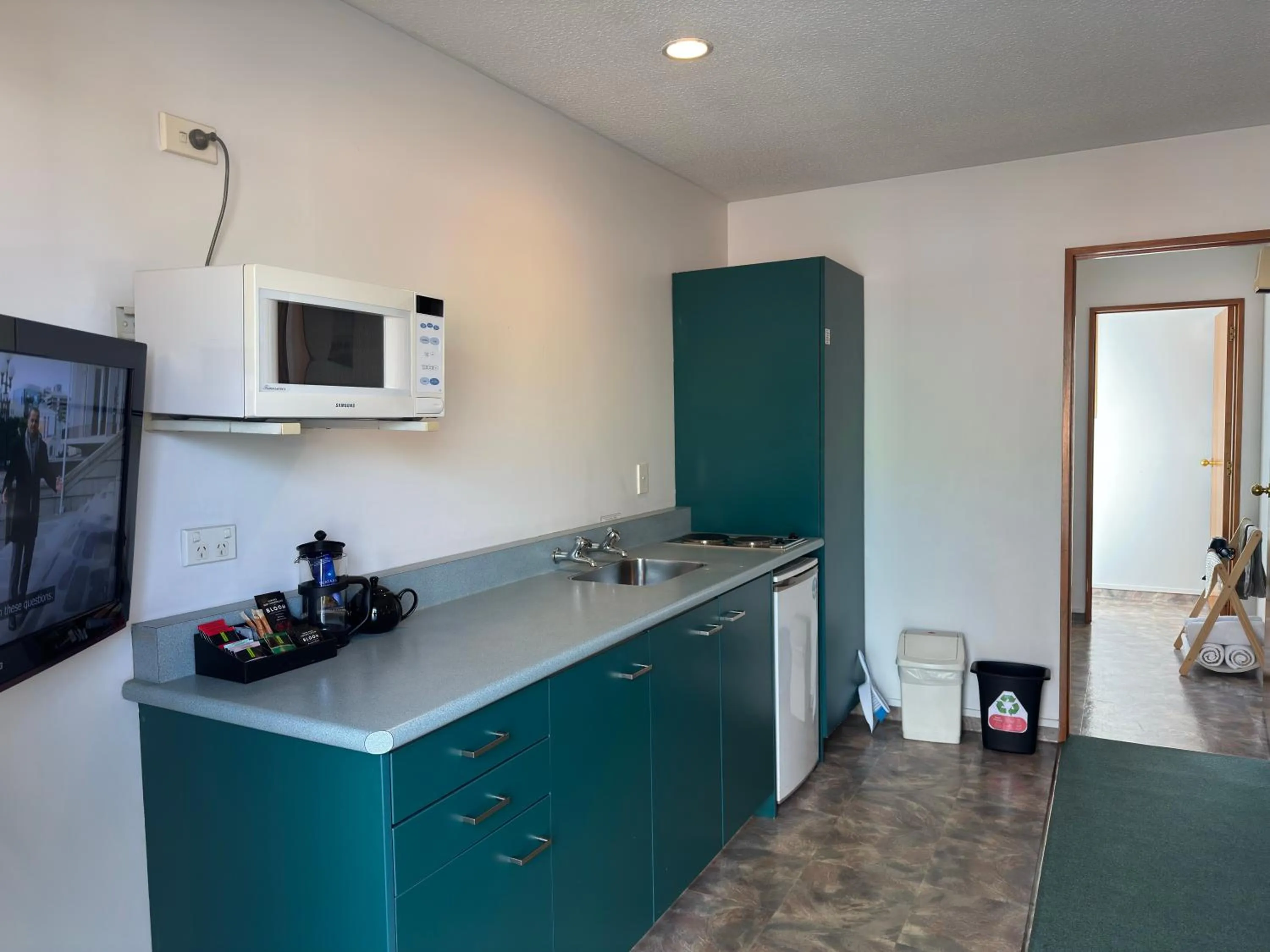 kitchen in ASURE Ambassador Motor Lodge