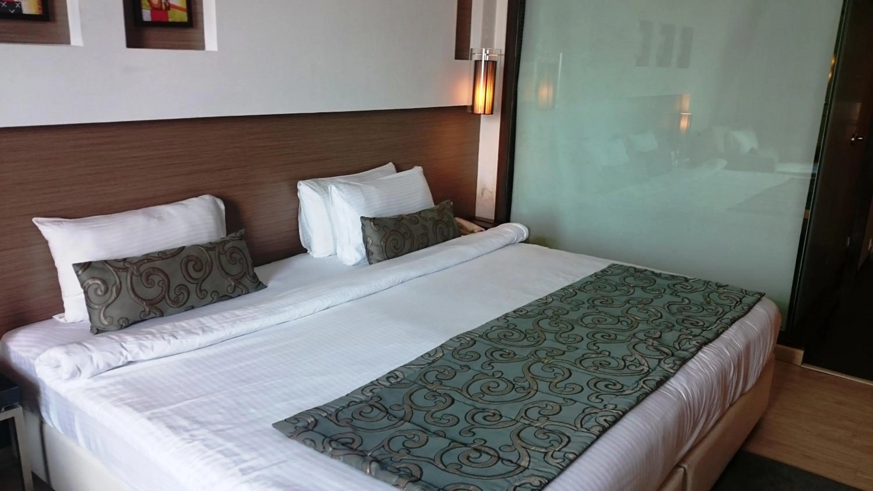 Bed in Ramada by Wyndham Navi Mumbai