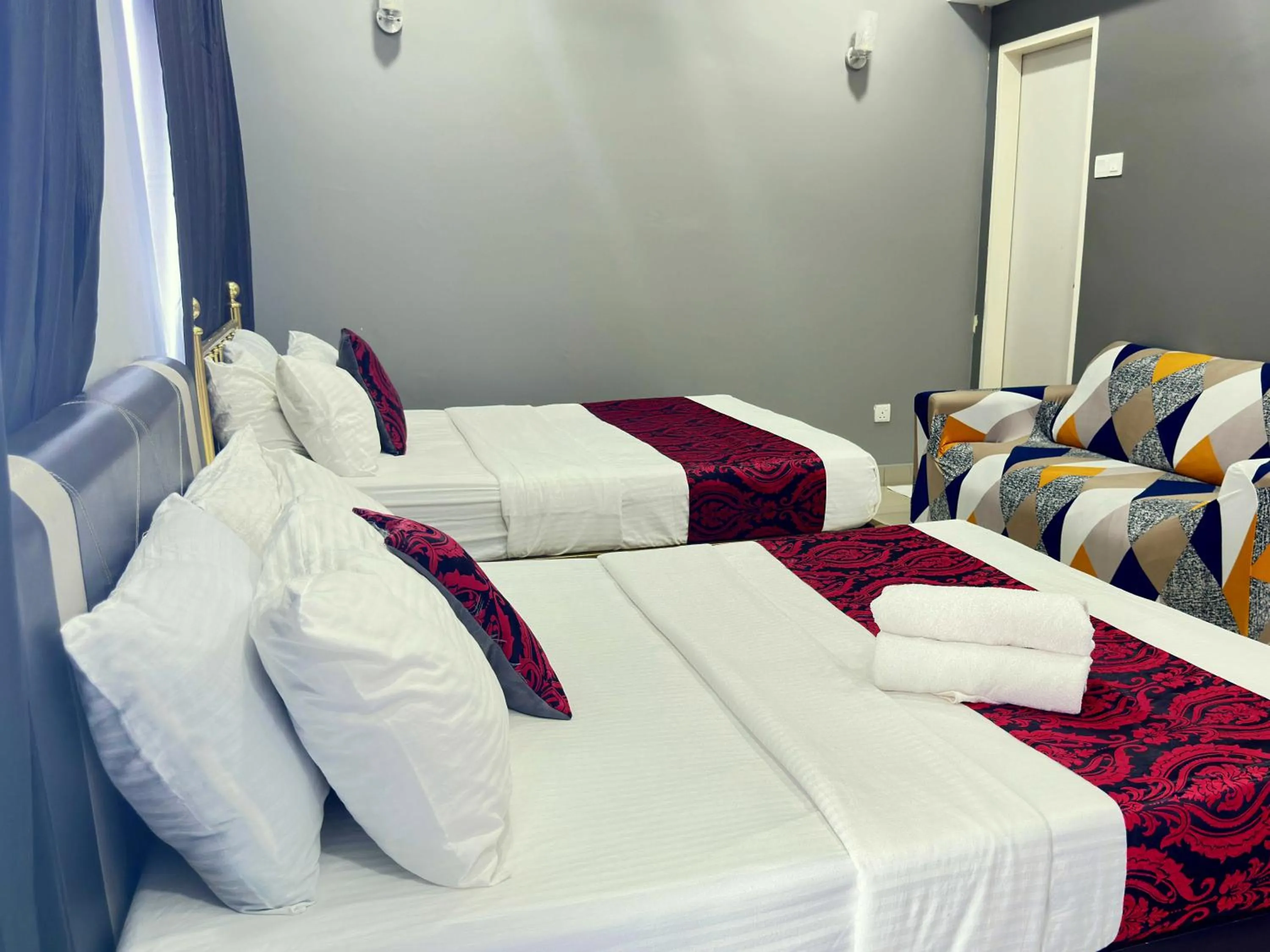 Seating area, Bed in Cahaya Qaira Homestay @ D'Perdana Kota Bharu