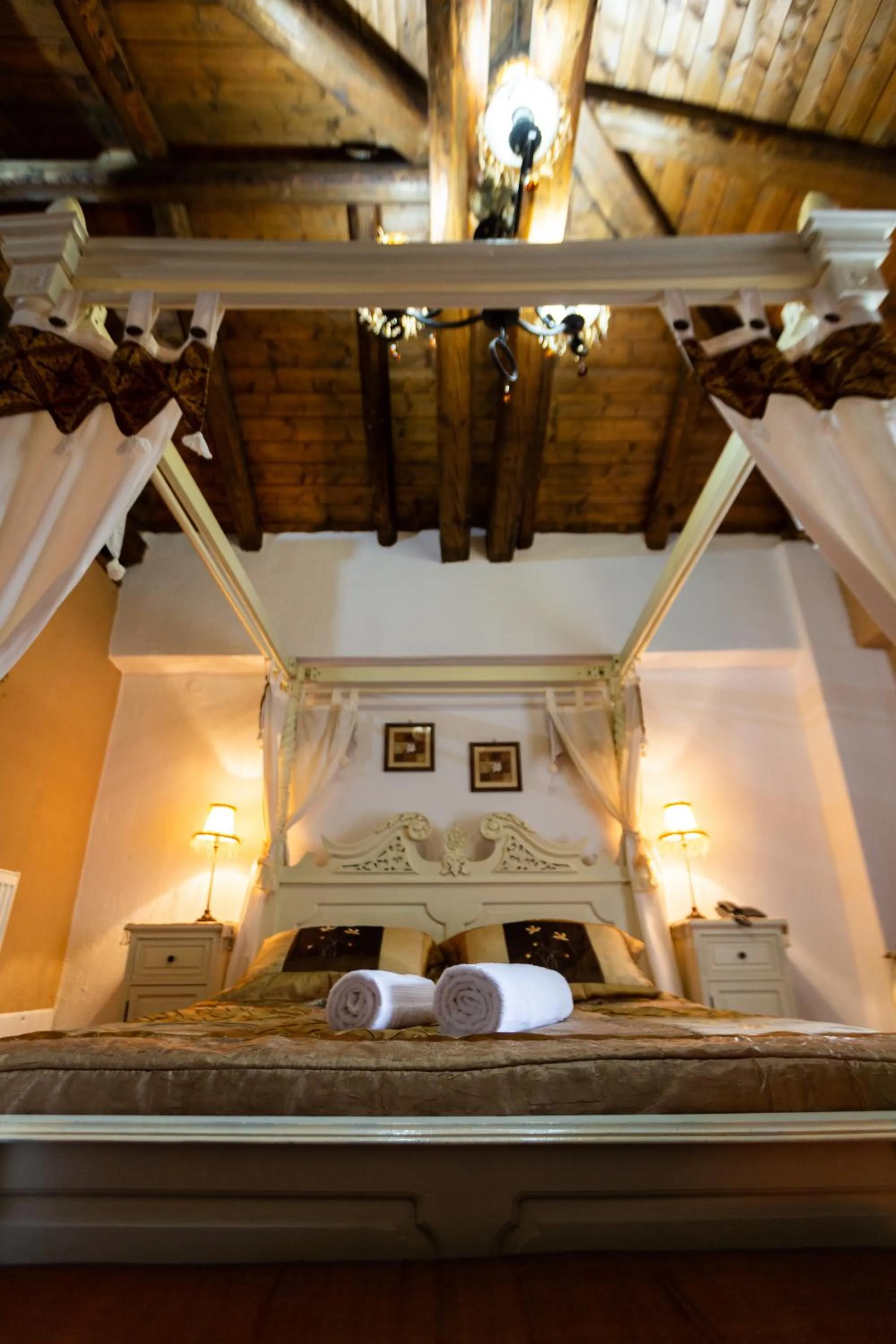 Bed in La Moara Boutique Hotel