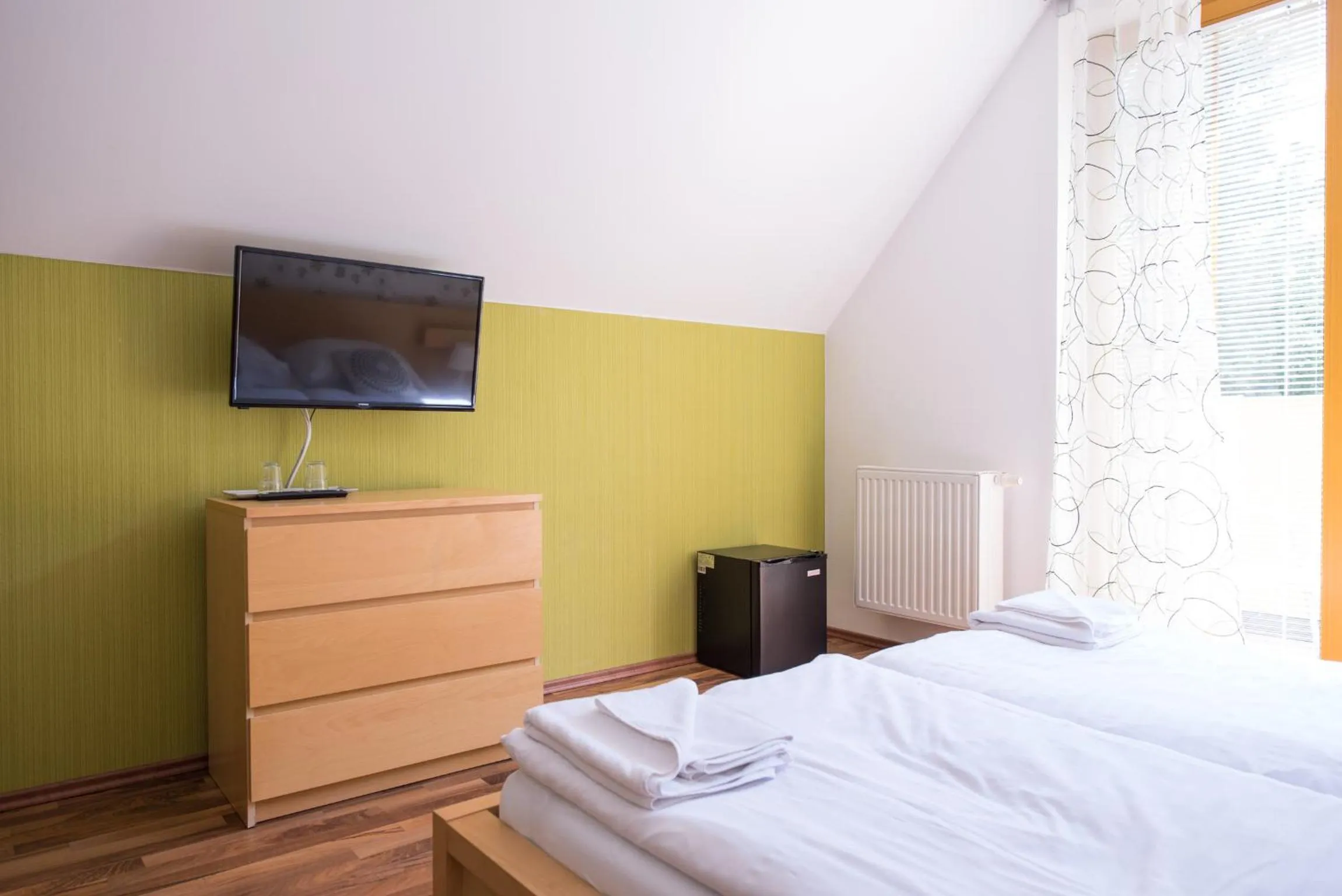 Living room, Bed in Hotel Garni Pod Skalkou