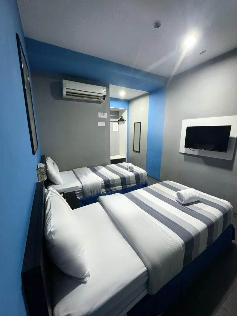 Bed in Metroinn Hotel