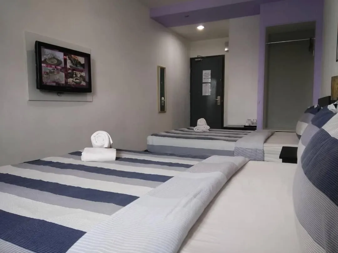 Bed in Metroinn Hotel