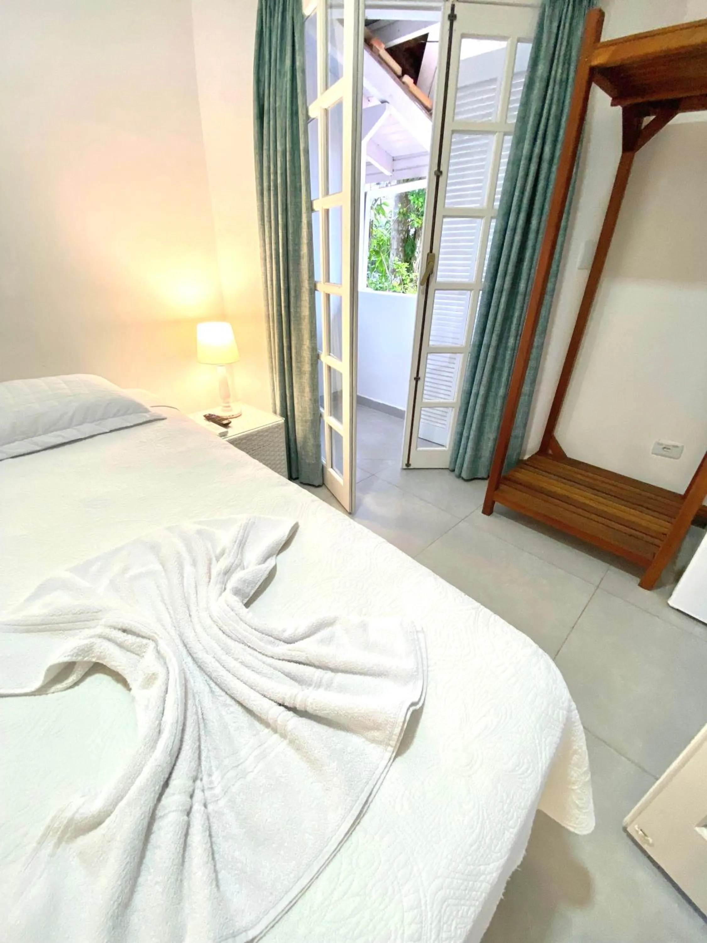 Bed in Pousada Tô na Praia Juquehy