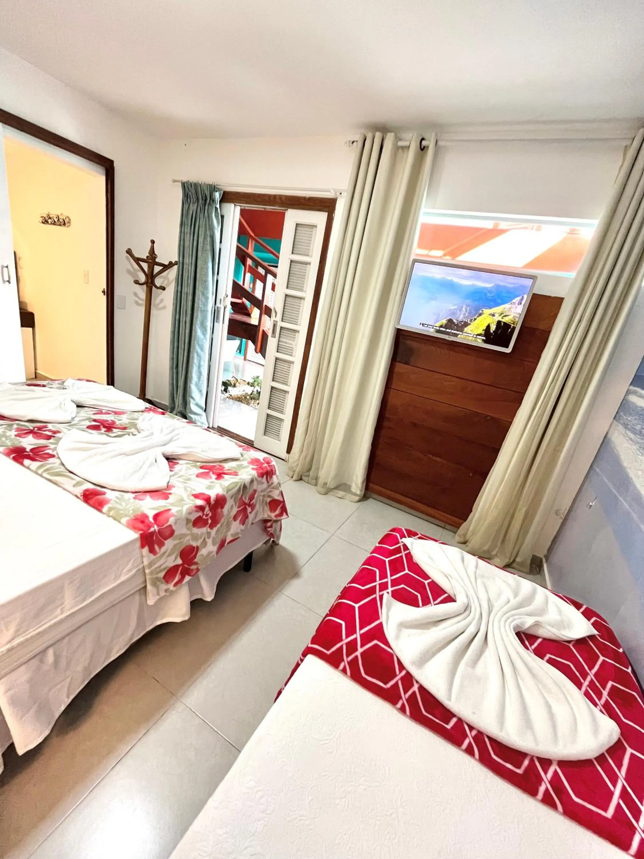 Bed in Pousada Tô na Praia Juquehy