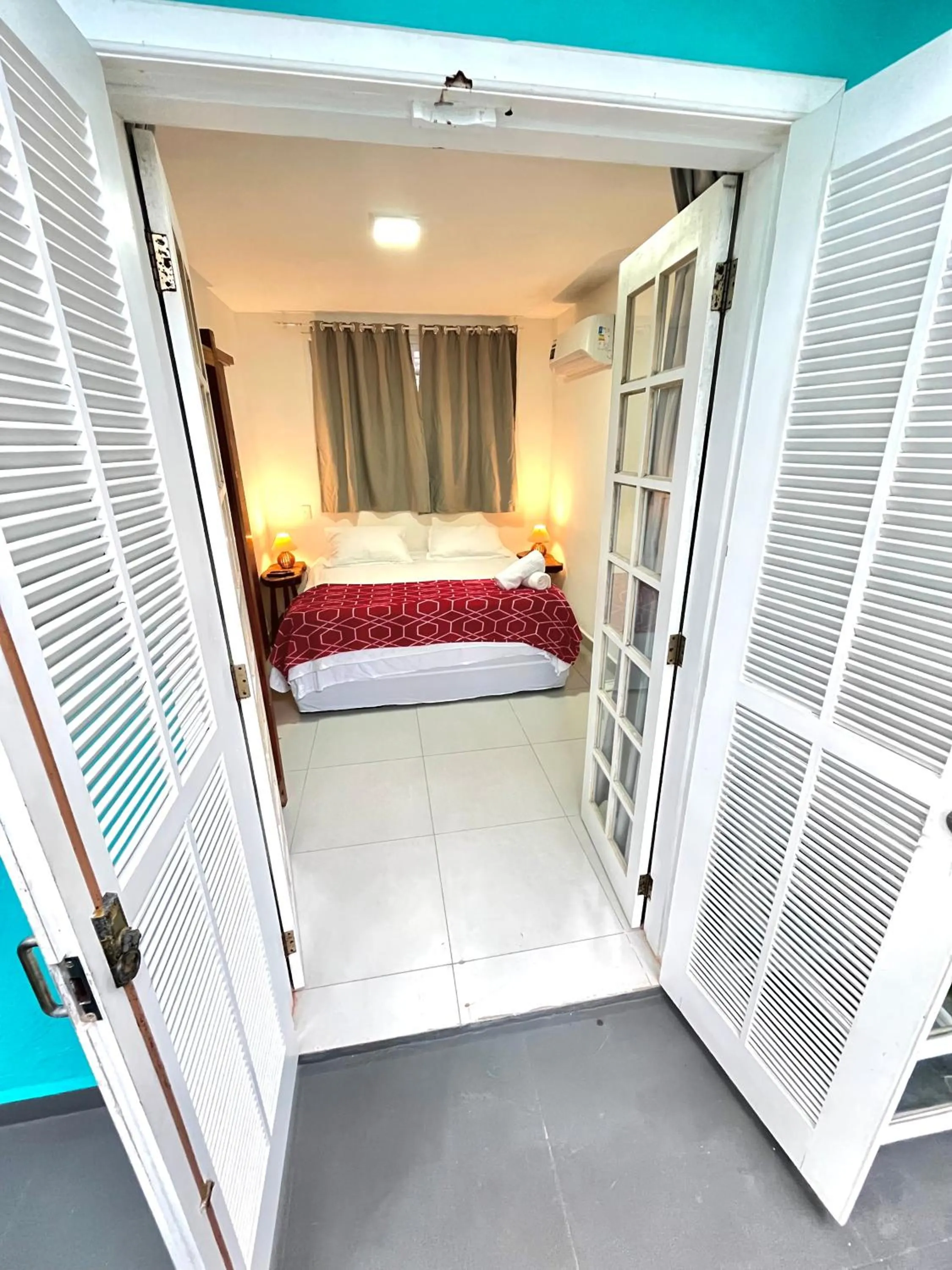 Bed in Pousada Tô na Praia Juquehy