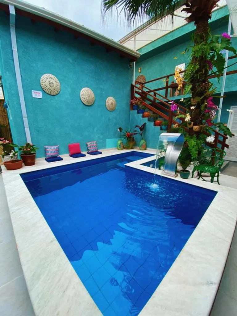 Swimming pool in Pousada Tô na Praia Juquehy