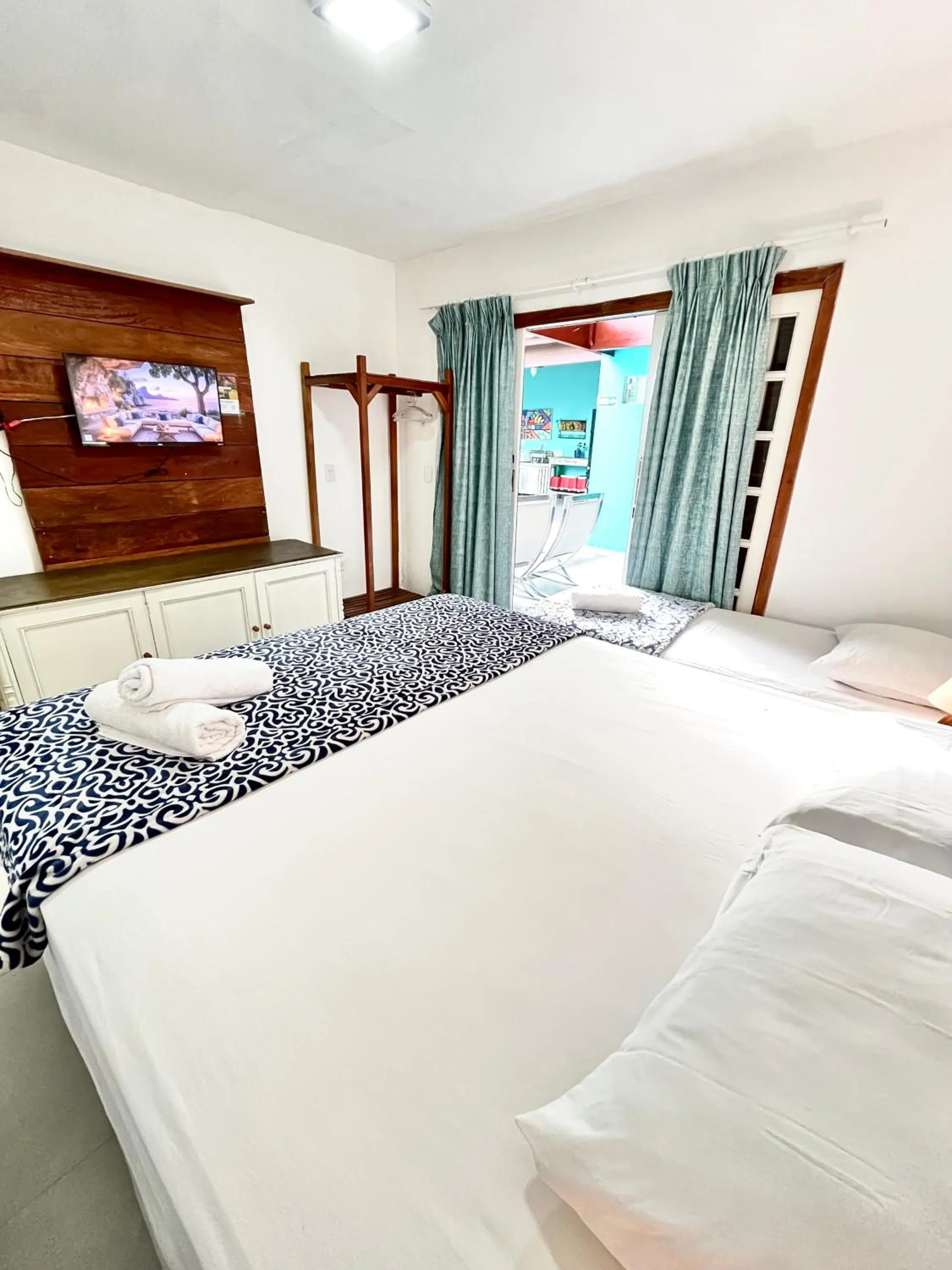 Bed in Pousada Tô na Praia Juquehy