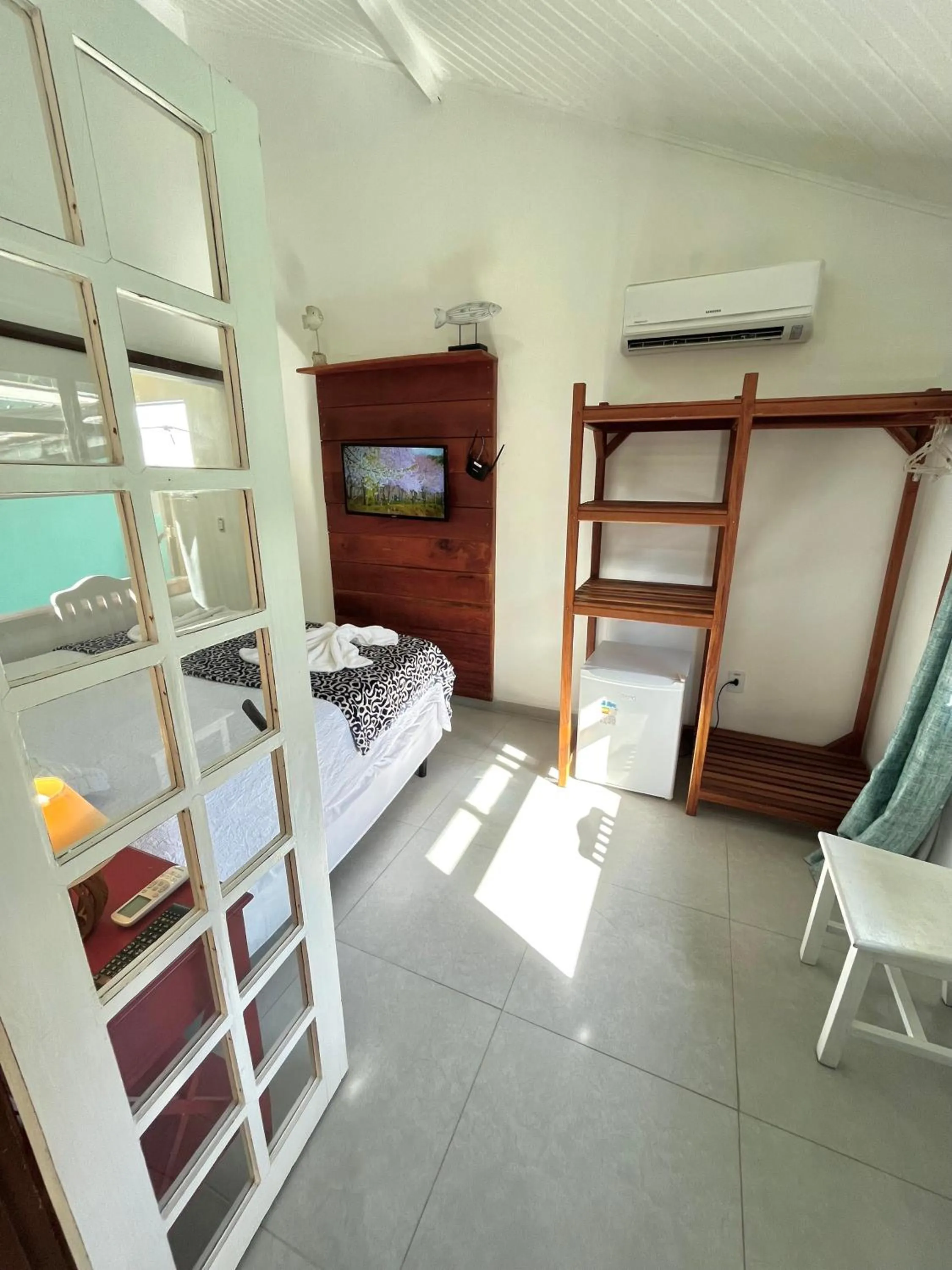 Bed in Pousada Tô na Praia Juquehy