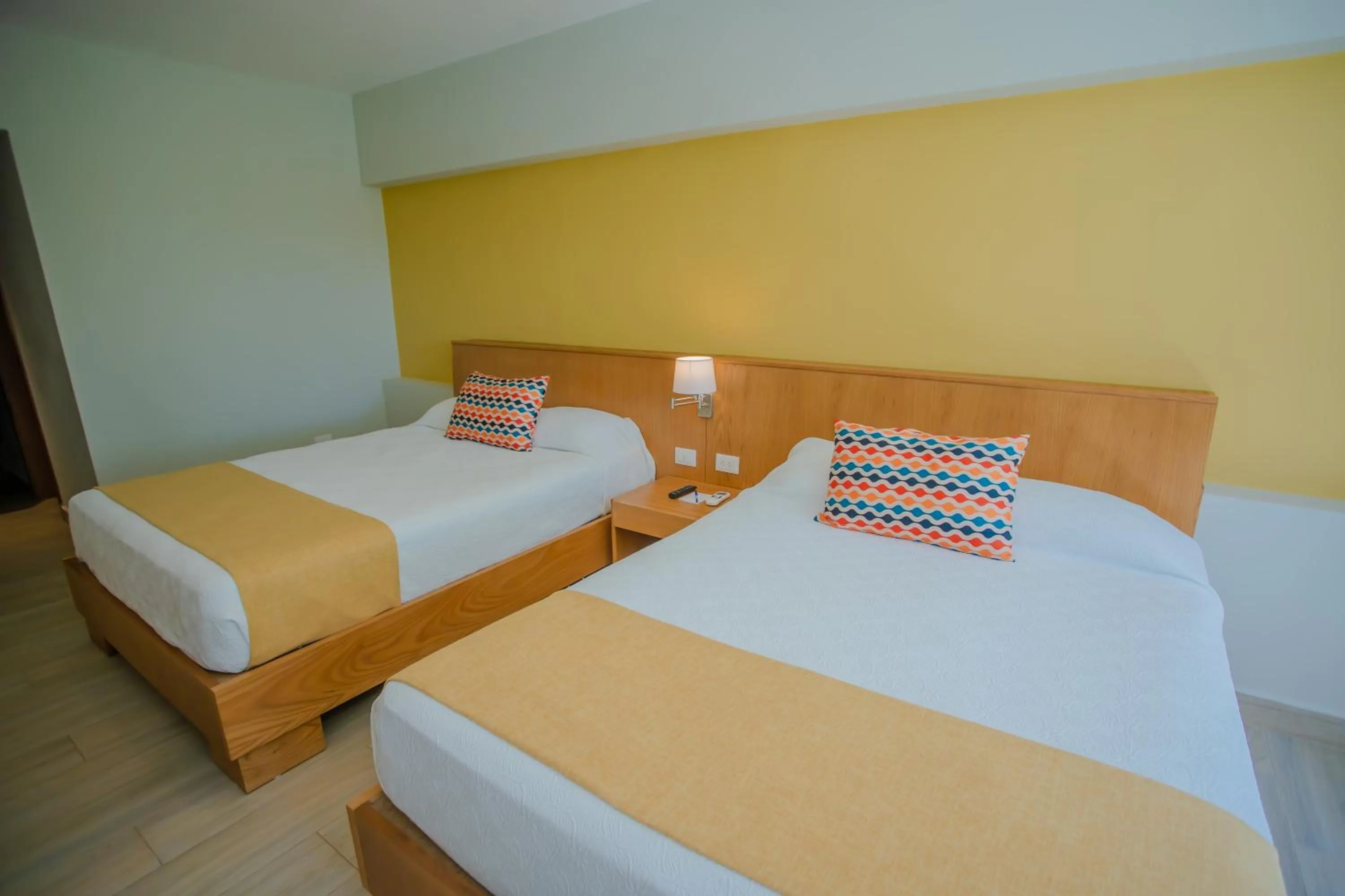 Bed in Coral Costa Caribe Beach Resort - All Inclusive