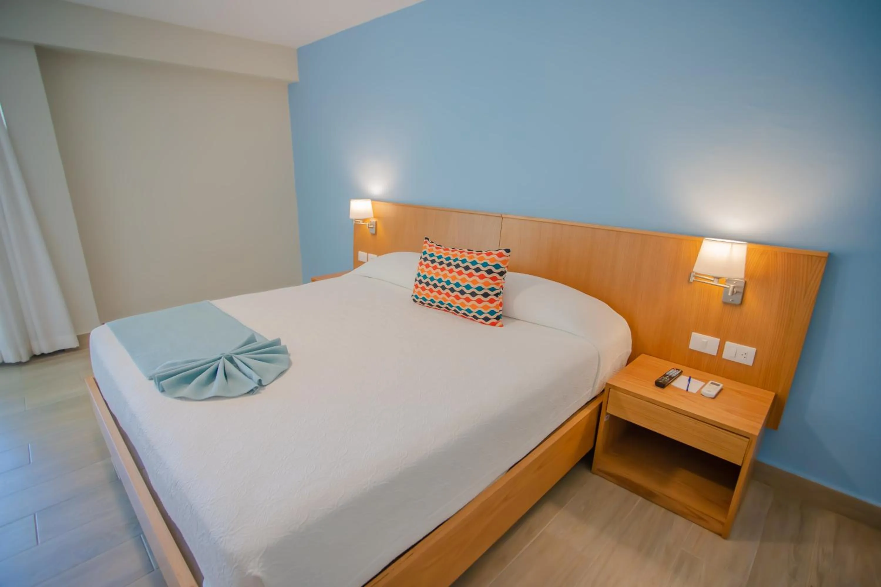 Bed in Coral Costa Caribe Beach Resort - All Inclusive