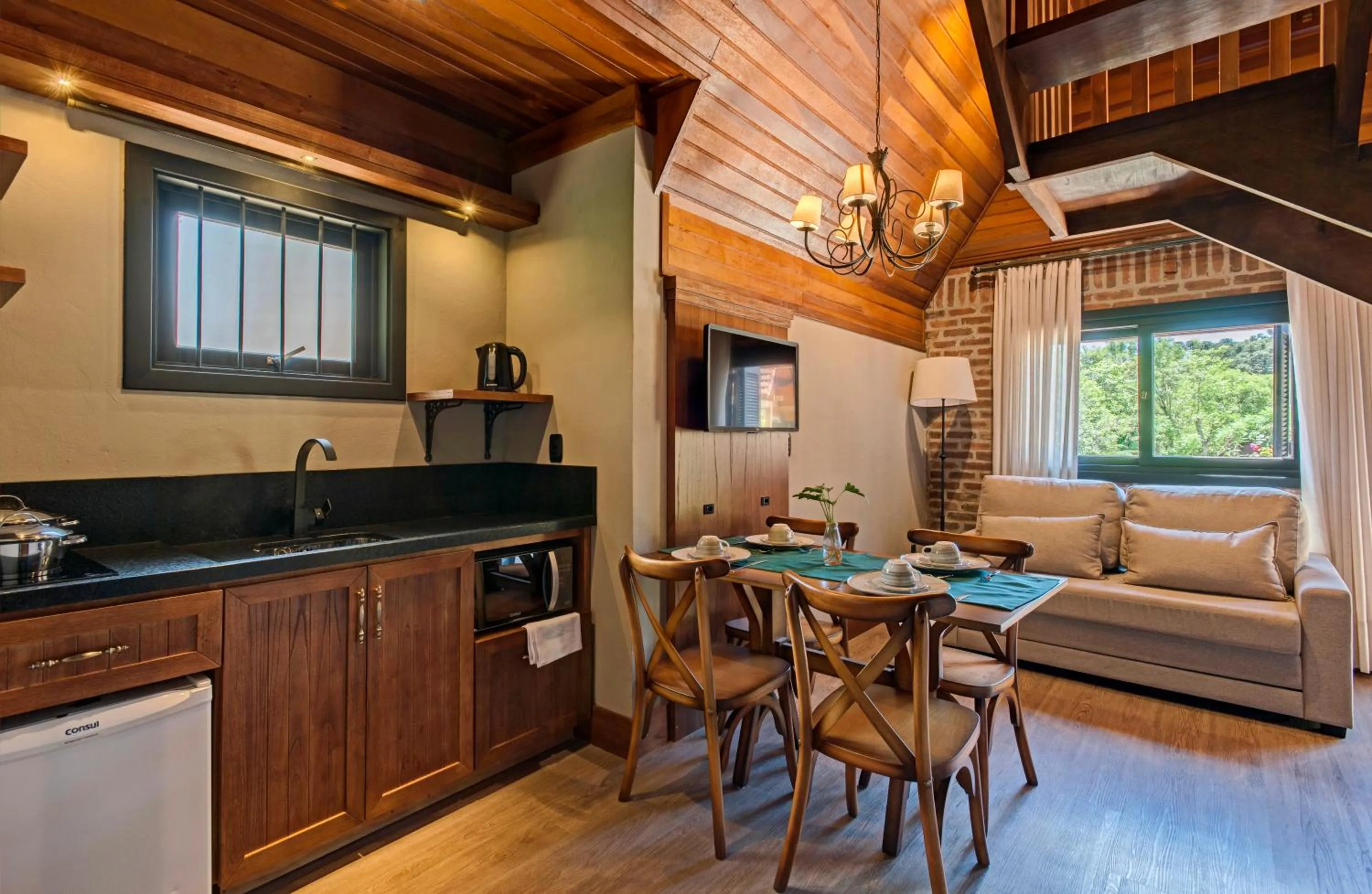 Communal lounge/ TV room in Hotel Fioreze Chalés