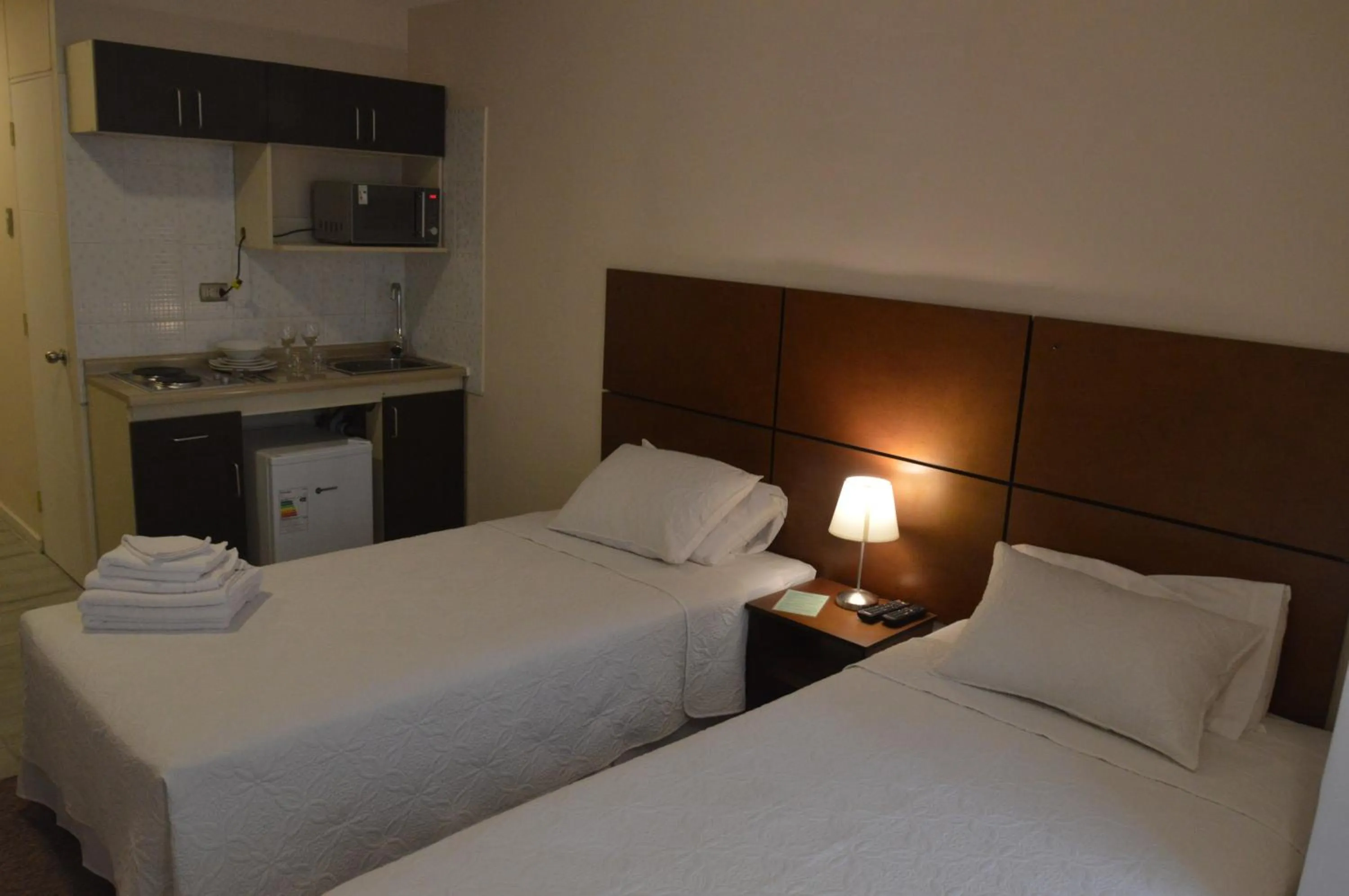 Bed in Origen Apart-Hotel