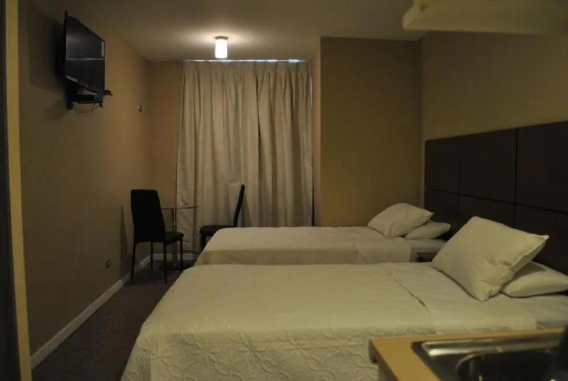 Bed in Origen Apart-Hotel
