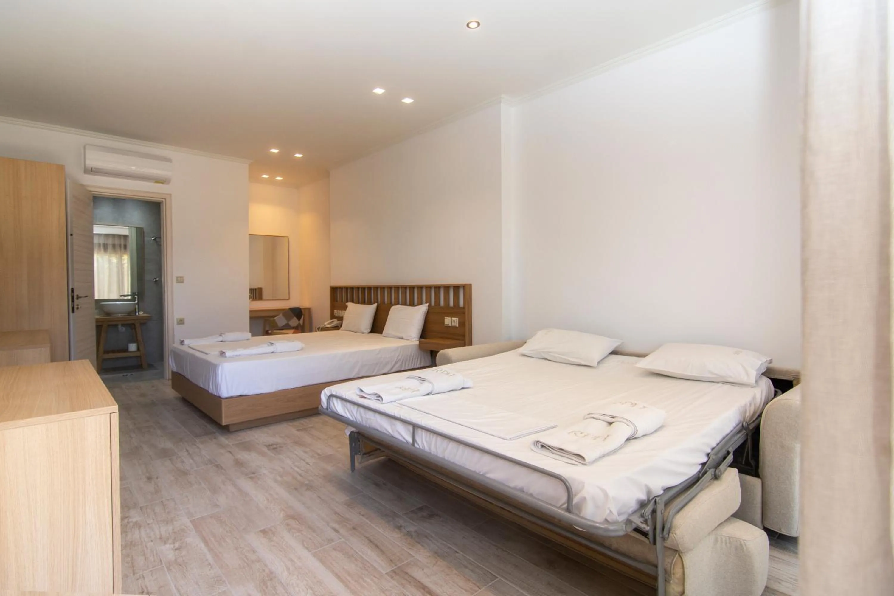 Bed in Riviera Perdika Hotel