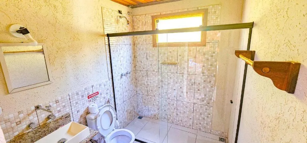 Bathroom in Cores e Flores da Serra Pousada by Concavus