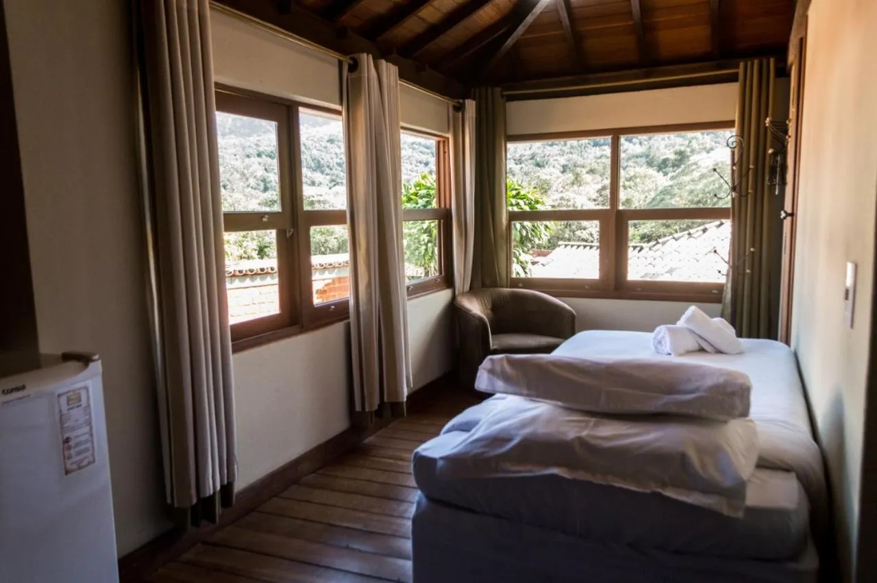 Bed in Pousada Papyrus