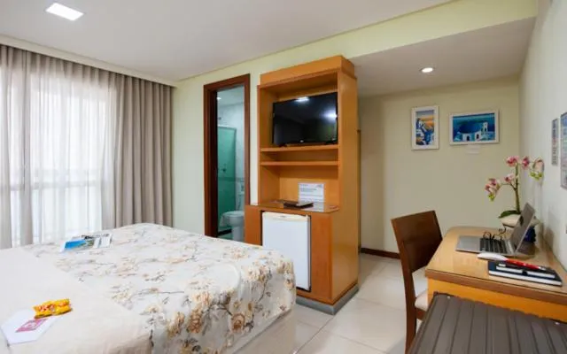 Dining area, Bed in Hotel Santorini