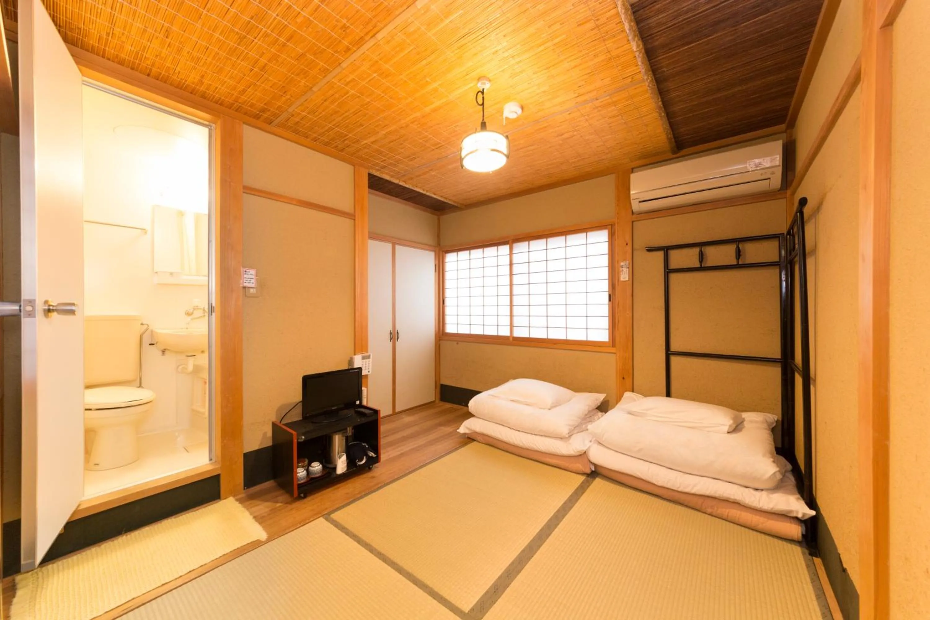 Bed in Nagomi-Ryokan Yuu
